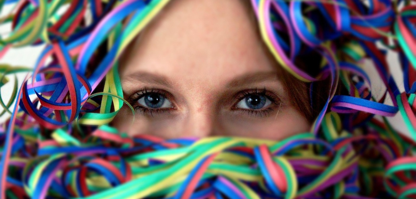 Woman celebrating Carnival Season with hearing protection.